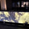 backlit amber onyx and black granite benchtop